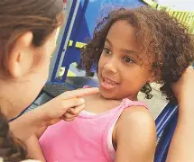 Group of children in a circle, discussing