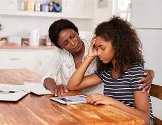 Anxious child holding hands with parent